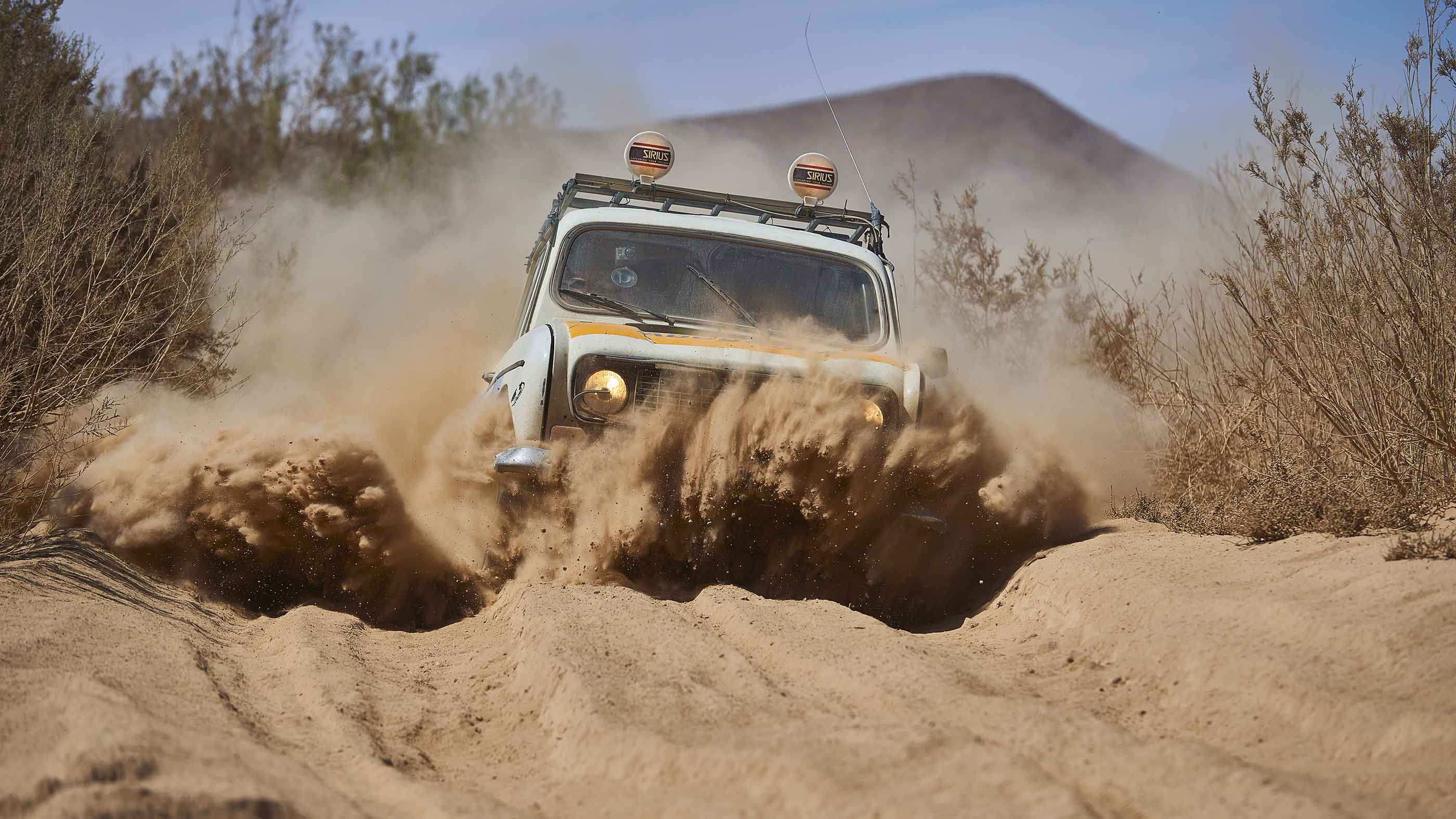 A Renault 4 in a sandy pass in Morocco